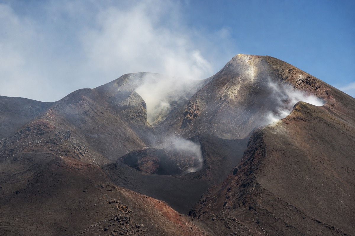 Steam rising from Mount Etna's central craters
